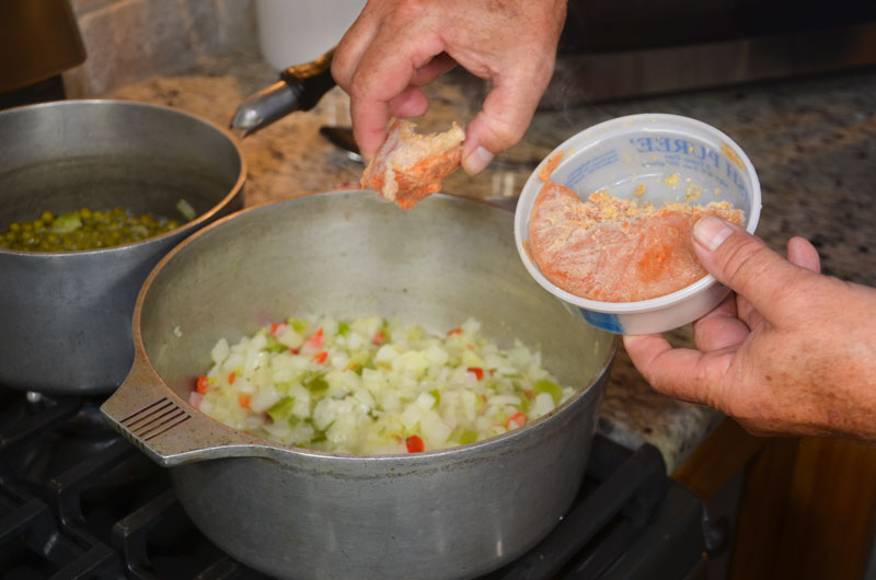Barry adds a chunk of frozen Crawfish Pureé, his “secret weapon,” to every crawfish étouffée he makes.