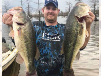 Donovan Stoner, of Atlanta, La., shows off a couple of nice Black Lake bass. Stoner said May is a great month to target postspawn fish before water temperatures really ramp up and summer heat takes hold.