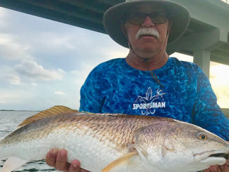 Bruce McDonald of Luling with a nice red he hooked at the Grand Isle bridge.