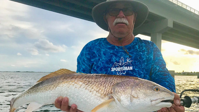 Bruce McDonald of Luling with a nice red he hooked at the Grand Isle bridge.
