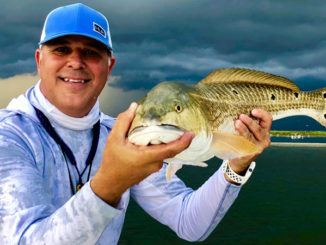 Capt. Davey Miles with Cajun Fishing Adventures shows off a nice redfish just minutes before a bad storm forced him to leave Breton Island last Friday. The good news is the Mississippi River has finally fallen to more normal late-summer levels, which should mean solid fishing this fall downriver.