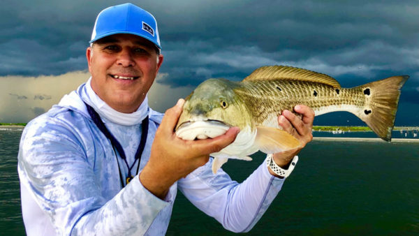 Capt. Davey Miles with Cajun Fishing Adventures shows off a nice redfish just minutes before a bad storm forced him to leave Breton Island last Friday. The good news is the Mississippi River has finally fallen to more normal late-summer levels, which should mean solid fishing this fall downriver.
