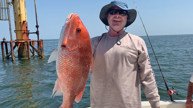 Tripp Staples with nice snapper he caught fishing out of Cypremort Point.