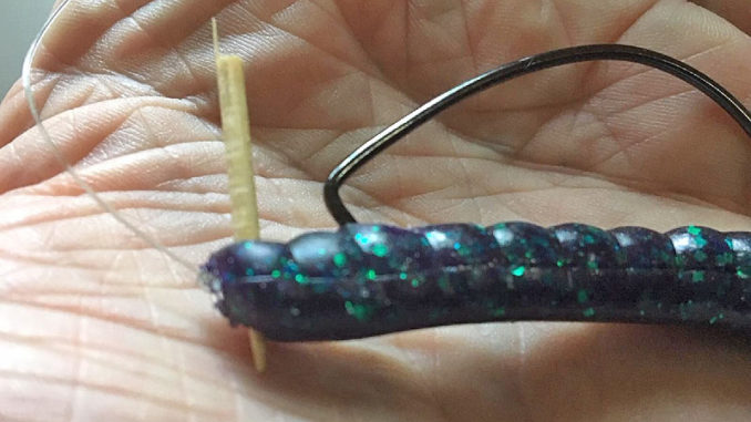 Using the tip of a toothpick, pushed through a soft-plastic bait and the eye of the hook, will help keep a Texas-rigged bait from sliding down. Break off both ends of the toothpick just outside the worm’s margins.