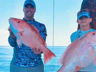 Shannon Prokasy and Mitchell Prokasy, 14, with red snapper. Mitchell's snapper weighed 22 pounds.