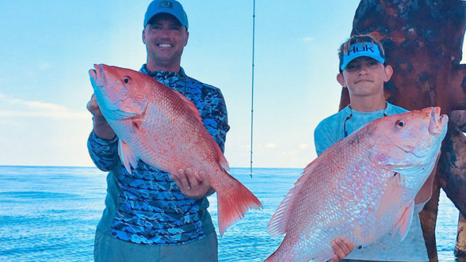 Shannon Prokasy and Mitchell Prokasy, 14, with red snapper. Mitchell's snapper weighed 22 pounds.