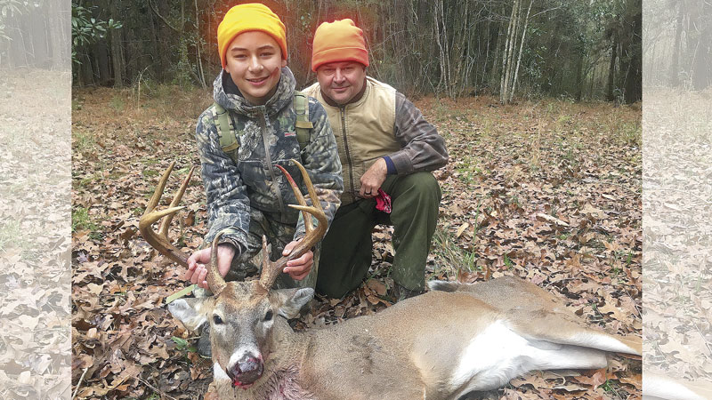 Thirteen-year-old Hans Seghers of Madisonville with his first deer, a big 9-point, shot on family friend Deano Bonano’s land in Kentwood in January.