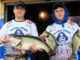Matthew Kahrs (left) displays his 10.9-pound Toledo Bend lunker, while his brother, Christopher, holds up two other bass taken Jan. 26 during the 2020 Mossy Oak Fishing Bassmaster High School Series event at Toledo Bend. The brothers placed second in the tournament with three bass weighing 15.6 pounds. (Photo courtesy of Ronnie Moore/B.A.S.S)