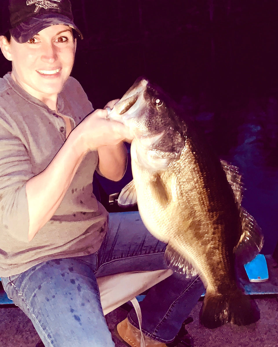 Kaycee LeBrun with her all-time biggest bass, an 11.14 pounder from Caney Lake caught right at dark.