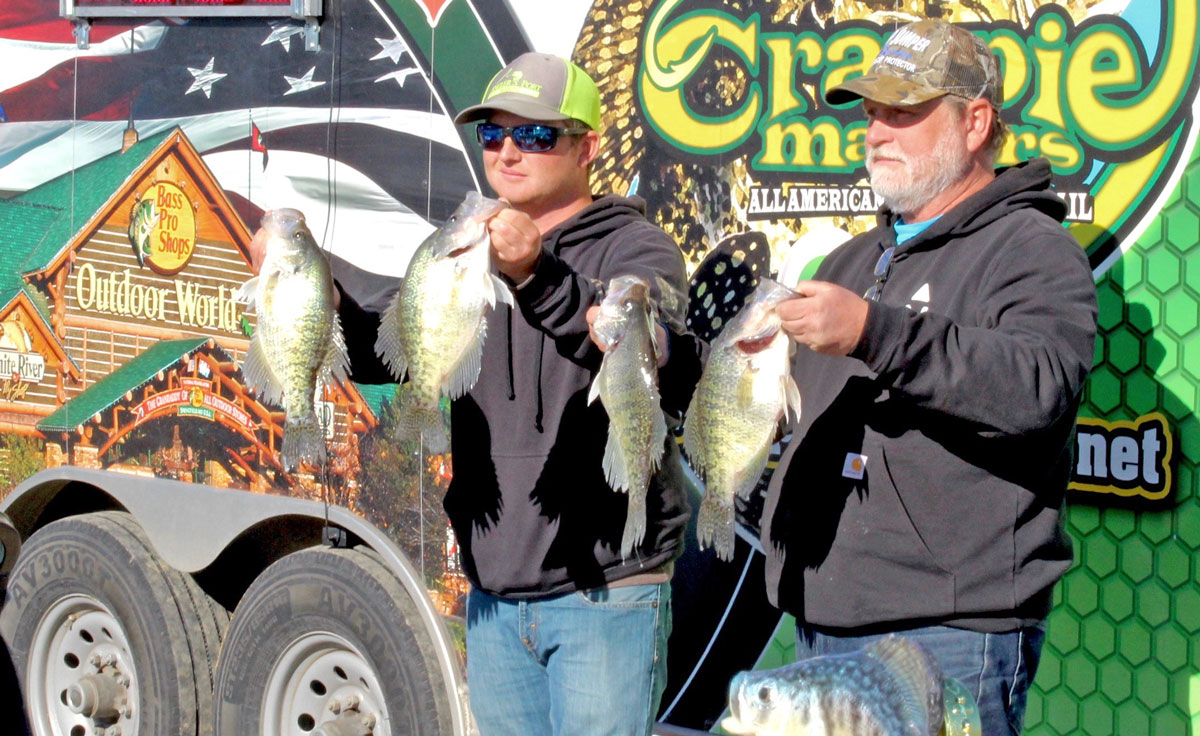 Matthew and Bruce Rogers with four of their Lake D’Arbonne slabs.