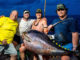 Mike McElroy III (far right) was on the rod when the crew of the Hook N Bull (from left, Mike McElroy II, Ryeley Jacobs and Luke Myers) landed a 236.6-pound yellowfin tuna out of Pass Christian, Miss., that appears to be a Mississippi state record. (Photo by John Michael Gory)