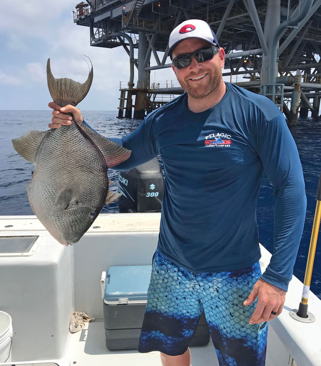 Brian Carlos of Luling with his 13.80 triggerfish caught on a piece of cut squid.