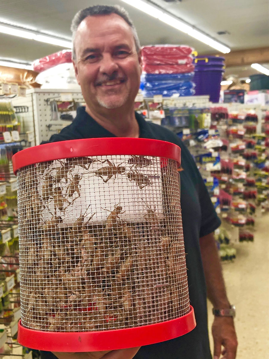 Darren Hebert of the Spillway Sportsman shows a bucket of prized crickets. This spring, the Sportsman and other dealers had to ration crickets to allow everybody to get to go fishing.