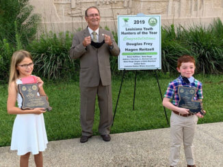 Hagen Reitzell (left), LDWF Secretary Jack Montoucet (middle) and Douglas Frey (right) during the 2019 Youth Hunter of the Year ceremony.