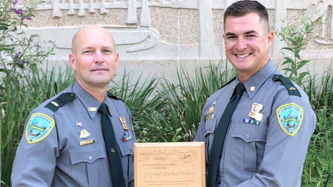 Lt. Lane Kincaid presents the 2020 Mississippi Flyway Council Award to Corporal Michael Hebert.