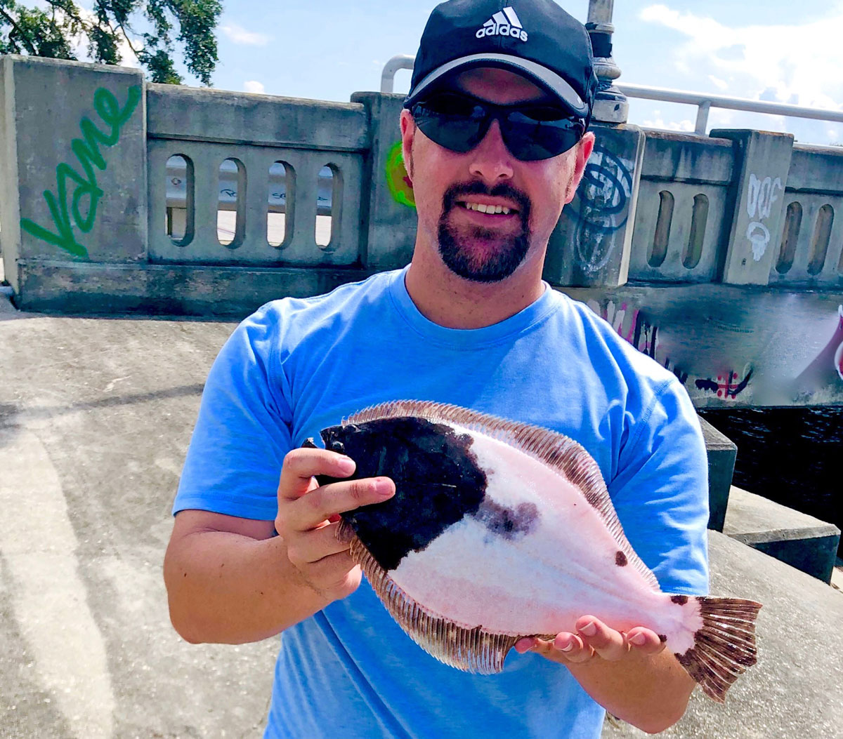 Austin Meche of Crowley shows his Lake Pontchartrain piebald flounder.