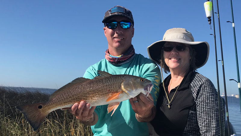 Mother and son redfish catch