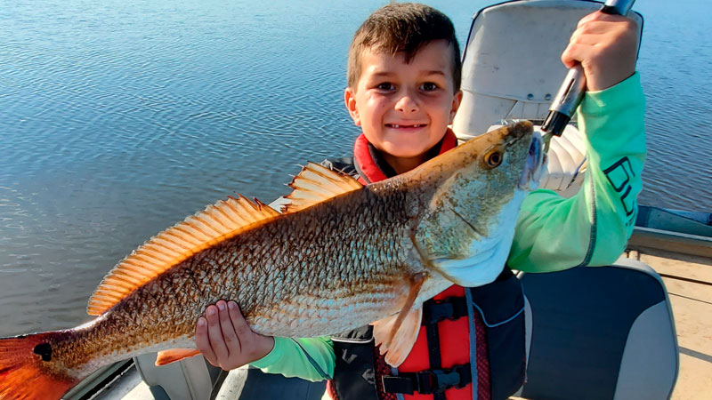 Young sportsman's first redfish