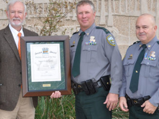 Shikar-Safari Club Representative Lea Perez presents the 2019 Shikar-Safari Club International 2019 Conservation Officer of the Year award to Sgt. Michael Garrity (Capt. Bryan Marie right). (Photo courtesy LDWF)