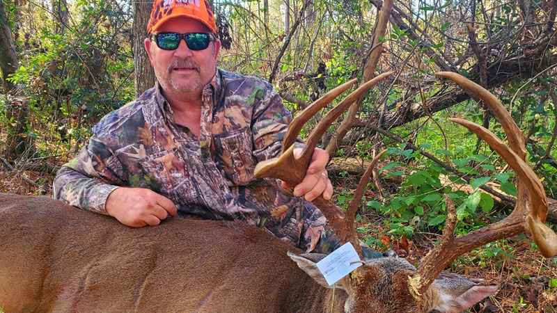 Teddy Dupuy took a big 8-point buck at Kisatchie National Forest in Grant Parish when he hung his climbing stand by a holly bush with scrapes.