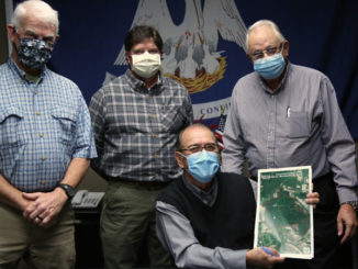 LDWF Secretary Jack Montoucet (seated) with (standing, left to right) John Rik Thistlethwaite, Lawrence Thistlethwaite and Dr. Patrick Thistlethwaite.