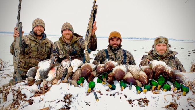 Cole Barthel (left) and a group of Simmons’ Sporting Goods hunters limited out Monday morning hunting in the rare north Louisiana snow.
