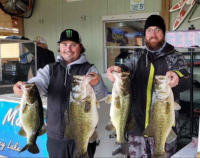 Tyler Stewart, left, and partner Matthew Colvin show their four biggest Caney bass from Jan. 30. Their biggest 10 weighed a whopping 62.6 pounds.