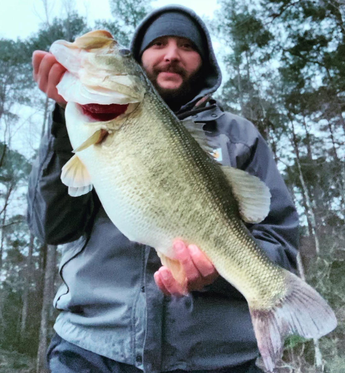 Hunter Cavalier holds up the big 11.9-pound Ivan Lake whopper, his personal best largemouth.