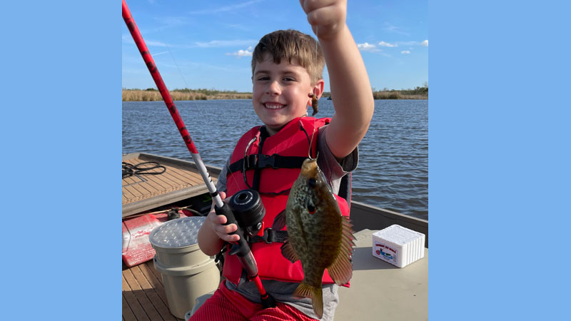 Landon lands fish at Lake Boeuf
