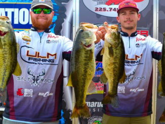 Jacob Andrews, left, and Connor Nimrod show off their outstanding catch, including the big bass of the event, a Caney Lake 11 pounder.