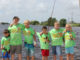 Participants from a Family Fish Fest take a quick break from fishing to pose for a picture. (Photo courtesy LDWF)