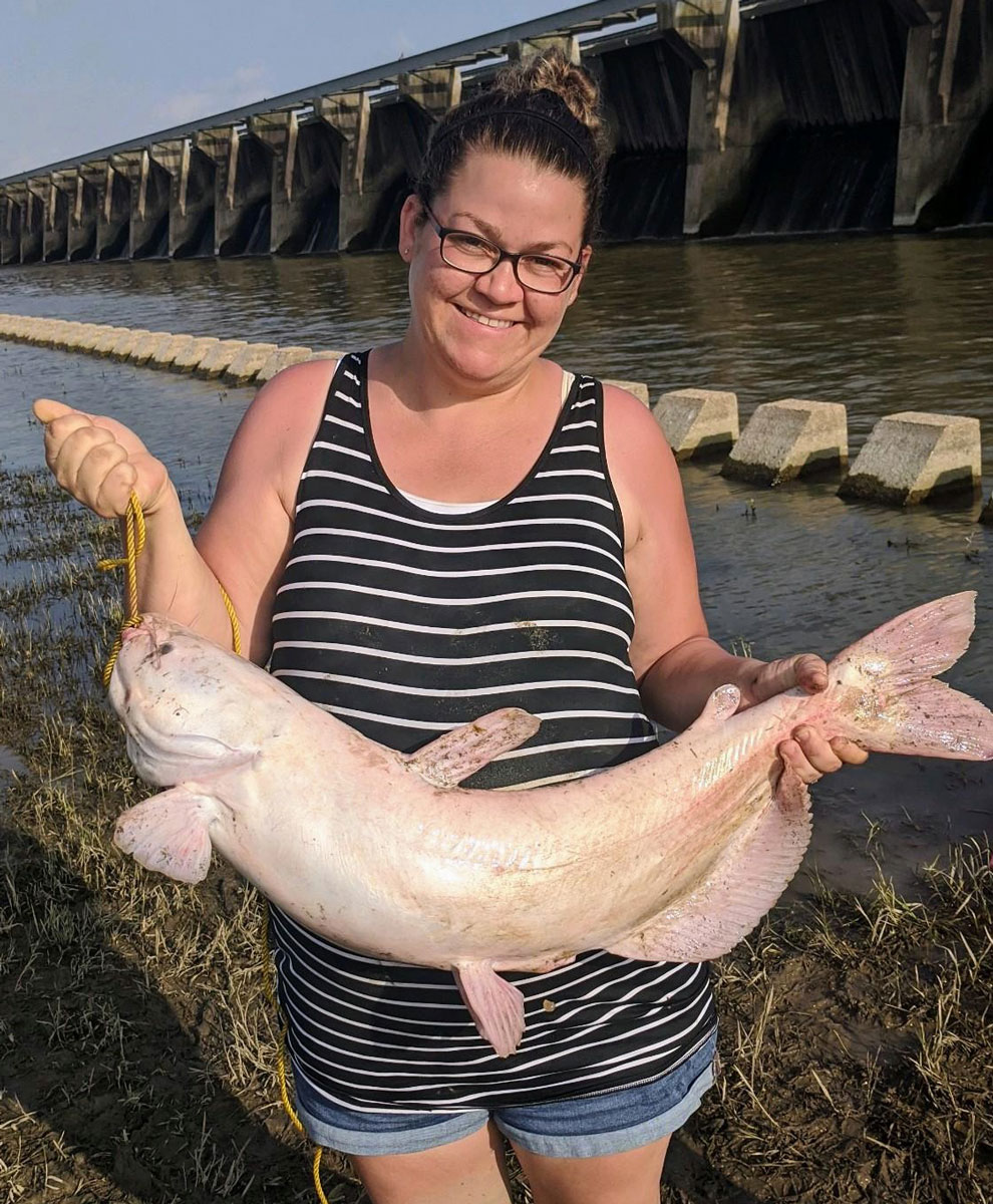 Katie Purvis Johns was fishing along the Bonnet Carré Spillway with her husband and daughter when she caught a 19-pound leucistic catfish.