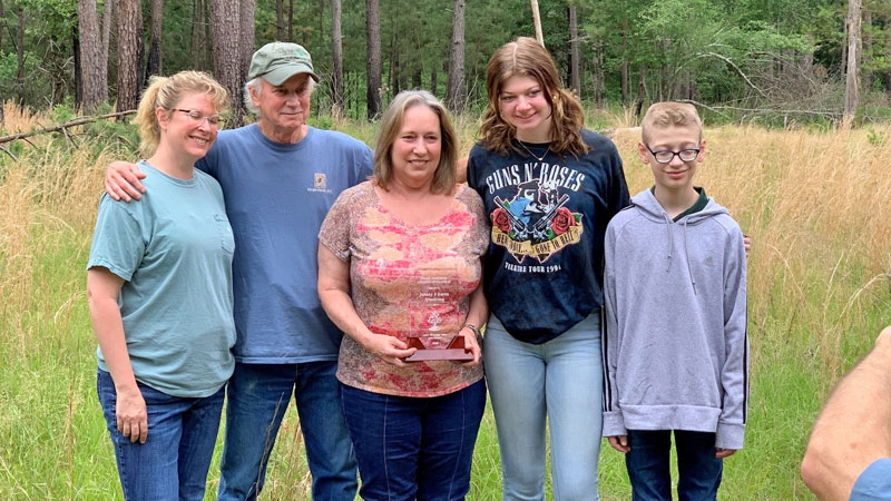 Dr. Johnny Armstrong (second from left) with his family (from left) daughter Abby Simpkins, wife Karen, granddaughter Tullie Simpkins and grandson Bain Simpkins.