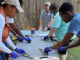 Aquatic Volunteer Instructor teaches attendees how to clean fish. (Photo courtesy LDWF)
