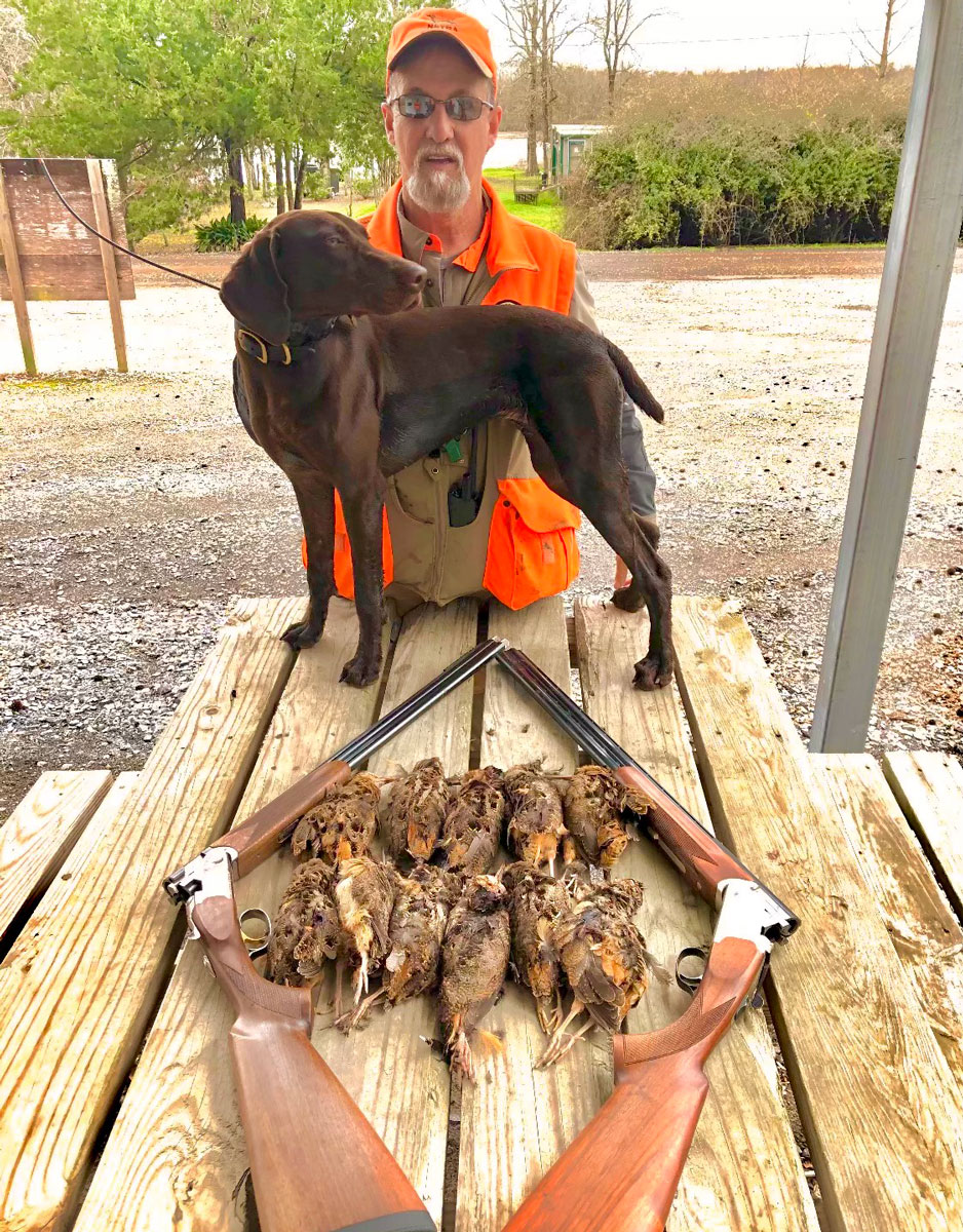 Oscar Long and Remi with the results of a successful hunt for Long and some friends.
