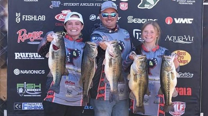 Alexis Virgilitto, left, and Tayor Bacot, right, get help from their boat captain, Alexis' father, Bradley Virgillito, holding their five bass weighing 30 pounds, 3 ounces. The "hawgs" caught by the Parkway High School Fishing Team topped a 109-angler field fishing The Bass Federation High School State Championship at Caddo Lake on March 13.