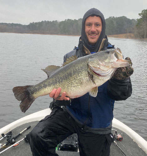  Michael LaGroue shows off his 10.77 pound Caney Lake lunker, also his personal best bass catch.