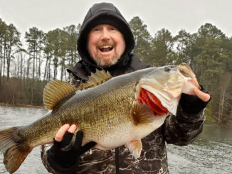 Jared King was all smiles with his personal best 13.01-pound behemoth largemouth that he caught from the waters of Caney Lake.