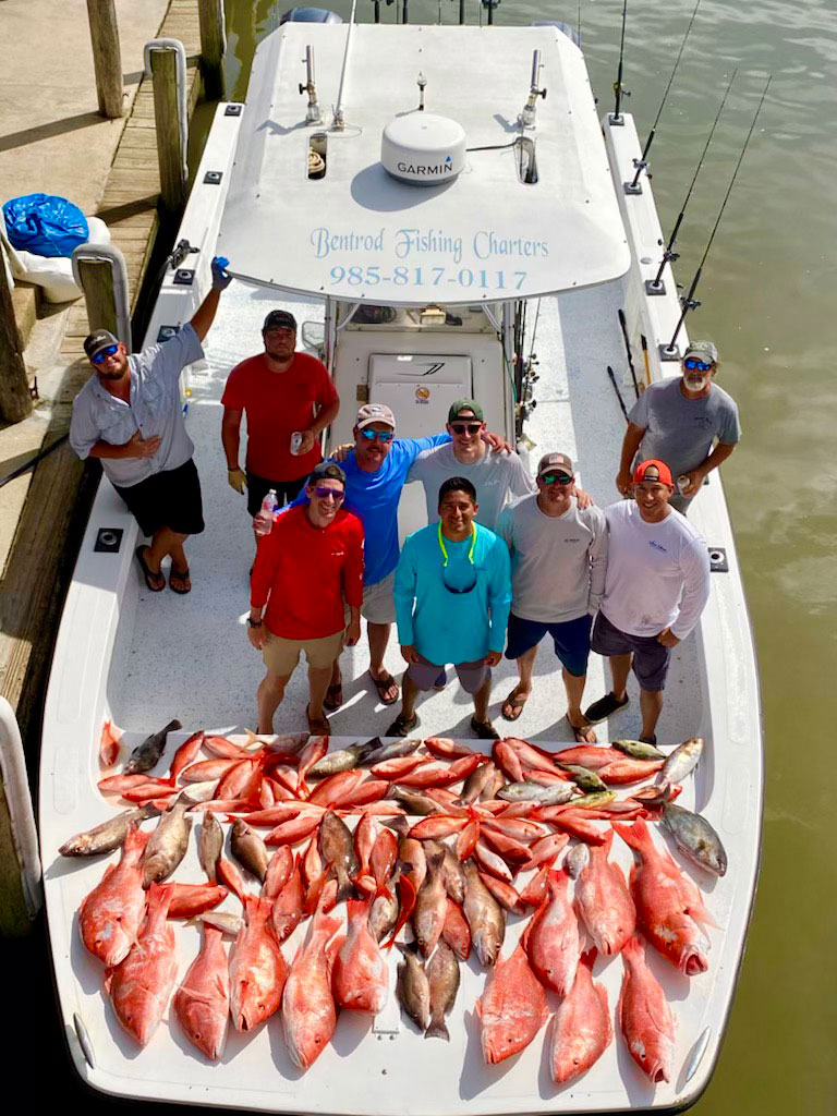 Capt. Kenny Heikamp and customers with a varied catch from one of his offshore trips.