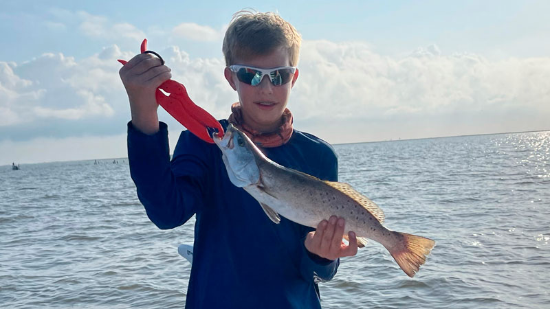 Gavin Seely, 13, with his personal best speckled trout. It measured 19 inches and was caught on a Voodoo shrimp in Barataria Bay.