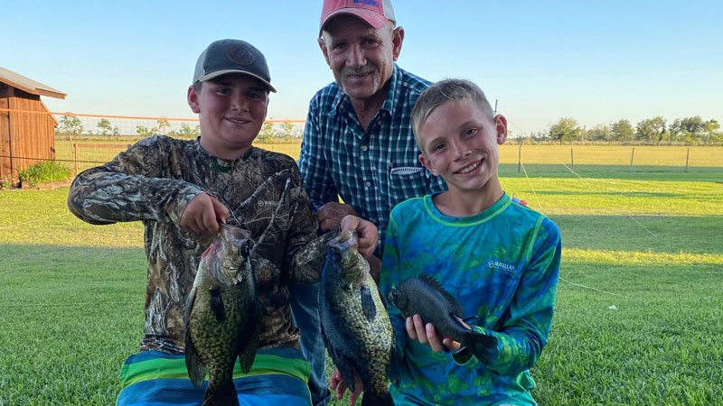 Ty Gaudet, Tony Dommert and Lane Gaudet show off a pair of 2 lb slab crappie and 1lb brim caught in pond in Sulphur,LA.