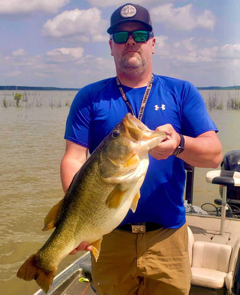 Jeremy Hinton holds his 11.10-pound Bussey Brake lunker largemouth.
