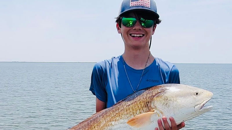 Bryson Gros with a 25-pound Hopedale bull red caught on June 24, 2022.