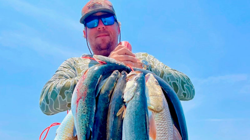 Cayce Causey of Hockley, Tex., with fish caught out of the Chandeleur Islands.