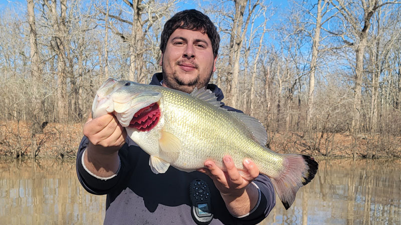 Dillon Devillier with a 7 1/2-pound bass, his new personal best, caught in Bayou Cocodrie inside Richard K Yancy WMA while sac-a-lait fishing on March 10, 2022.