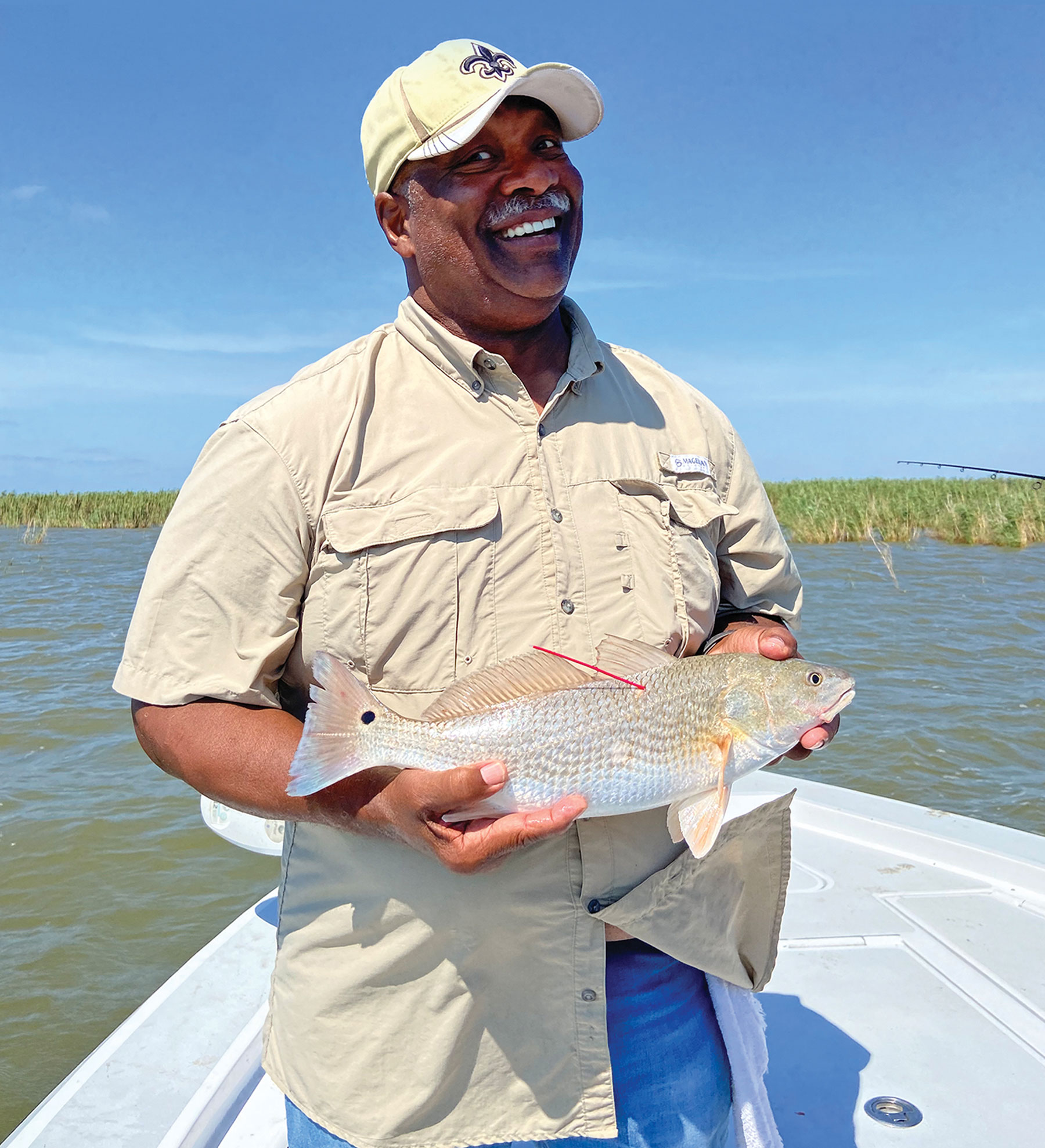 If you don’t think winning makes you happy, just check out Kenneth Nash, the 2021 STAR winner of the Chevy Silverado for the first tagged redfish caught. (Photo courtesy CCA)