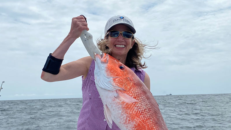 Donna OBrien with a big red snapper caught out of Fourchon.