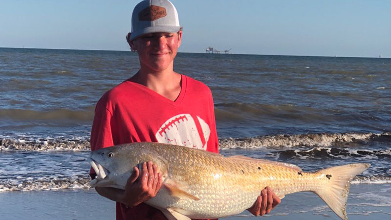 Brothers Tanner, 14, and Gabe David, 12, caught nice bull redfish, 41 inches in length, fishing the surf at Mae's Beach near Holly Beach!