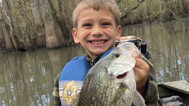Jase LeBlanc, 8, from Ponchatoula catching some winter sac-a-lait in the deep holes of the Tangipahoa River.