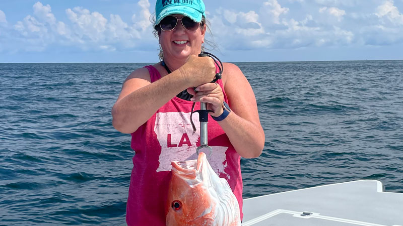 Jodi Mallett was fishing in Fourchon with Capt. Kurt O’Brien when she landed this red snapper that weighed 14.85 pounds on a piece of pogey.